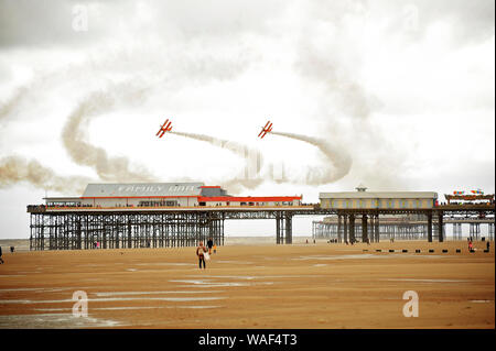 Wing walkers on biplanes flying over Central Pier during blackpool air show 2019 Stock Photo