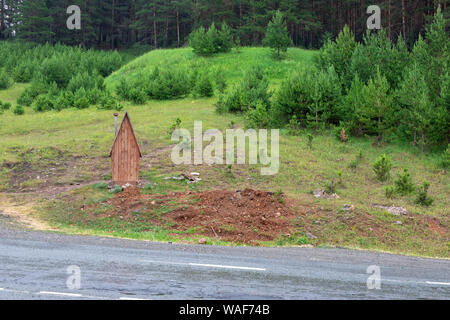 free wooden toilets standing near along the highway, near the road Stock Photo