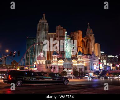 Stretch limousine in front of New York New York Hotel and Casino at night, Las Vegas Strip, Las Vegas, Nevada, USA Stock Photo