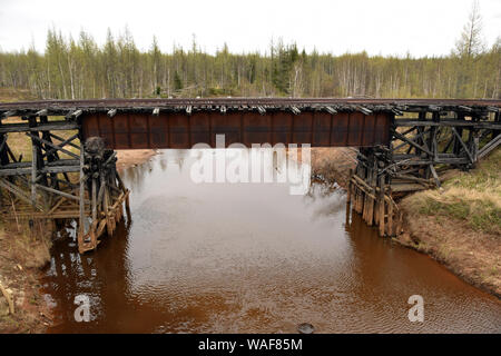 Railway bridge. The remains of the 'Dead Road' built by the slave labourers of the Gulag system between 1949 and 1953. This railway links the towns of Salekhard and Nadym in the Yamalo-Nenets Autonomous Region. It was an almost technically impossible project started by Stalin and stopped by the soviet authorities immediatly after the death of the dictator. Stock Photo
