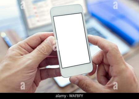 Mobile smartphone with blank white screen holding in man hand Stock Photo