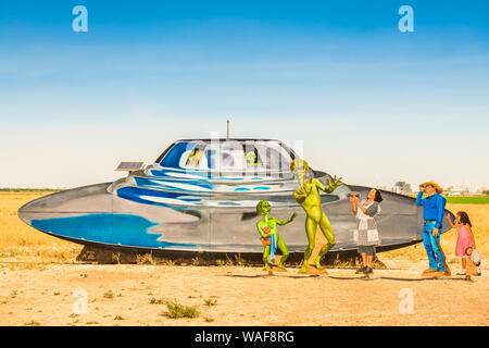 ROSWELL, NEW MEXICO - JUNE 23, ,2019: Welcome sign on the outskirts of Roswell depicting an alien encounter. Roswell is known for the UFO Incident of Stock Photo