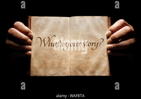 What's your story? hands holding an open book background message Stock Photo