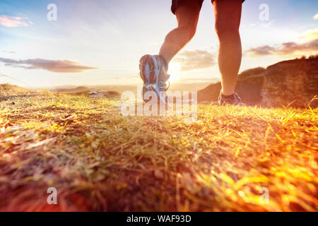 Outdoor cross-country running in morning sunrise concept for exercising, fitness and healthy lifestyle Stock Photo