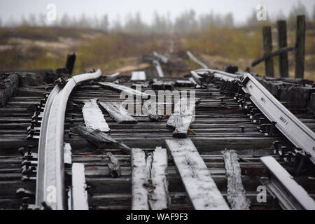 A railway bridge. The remains of the 'Dead Road' built by the slave labourers of the Gulag system between 1949 and 1953. This railway links the towns of Salekhard and Nadym in the Yamalo-Nenets Autonomous Region. It was an almost technically impossible project started by Stalin and stopped by the soviet authorities immediatly after the death of the dictator. Stock Photo