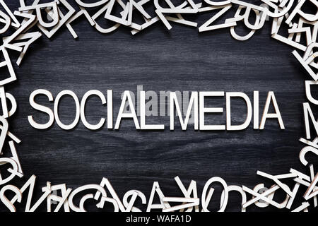 Social Media wooden letters on black board Stock Photo