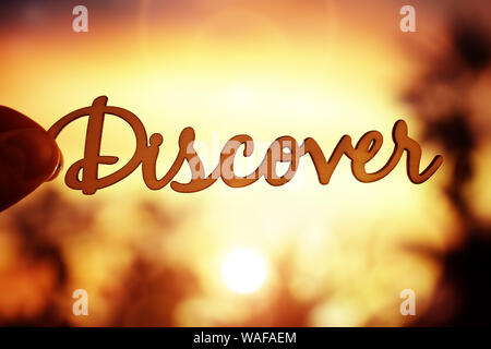 Discover written word summer vacation concept against sunset Stock Photo
