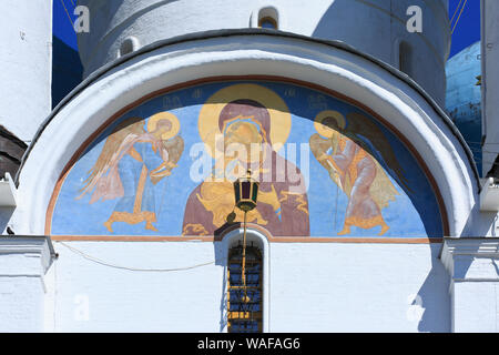 Close-up of a wall painting of Mary with Child on the face of the Cathedral of the Assumption (1559-1585) in Sergiyev Posad, Russia Stock Photo