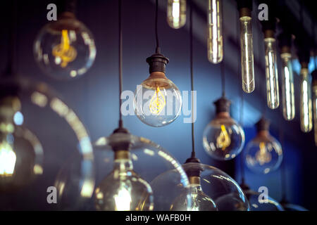 Light bulbs hanging in a row Stock Photo