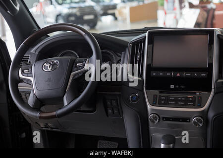 Russia, Izhevsk - July 18, 2019: Toyota showroom. Interior of new Land Cruiser 200. Famous world brand. Prestigious cars. Stock Photo