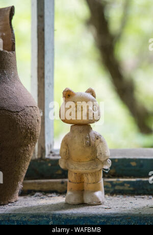 Chernobyl Exclusion Zone - Zarissya Village - Abandoned house - Toy on window sill Stock Photo