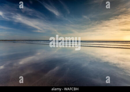 Reflections on the beach at low tide, Saunton Sands, on the stunning north Devon coast. Stock Photo