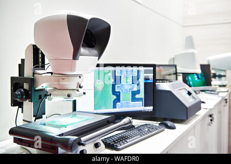 Measuring microscope with monitor to control parts in manufacturing Stock Photo