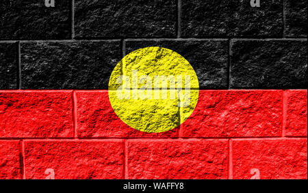 Australian Aboriginal flag painted on the cracked grunge concrete wall ...