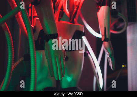 Close-up of humanoid robot head with micro-cameras eyes on blurred background Stock Photo