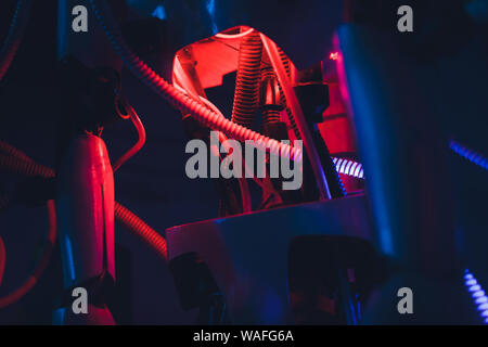 Close-up of humanoid robot head with micro-cameras eyes on blurred background Stock Photo