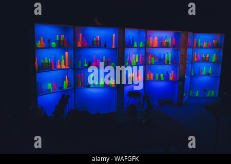 Pharmacy and chemistry theme. Test glass flask with solution in research laboratory. Science and medical background. Laboratory test tubes on dark ton Stock Photo