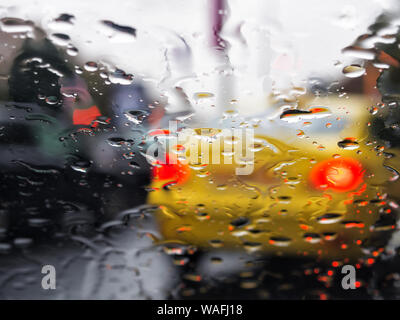 rain droplets on car windshield, traffic in city Stock Photo - Alamy