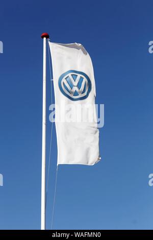 Horsens, Denmark - September 30, 2015:  Volkswagen logo on a flag. Volkswagen is a German car manufacturer headquartered in Wolfsburg, Germany Stock Photo