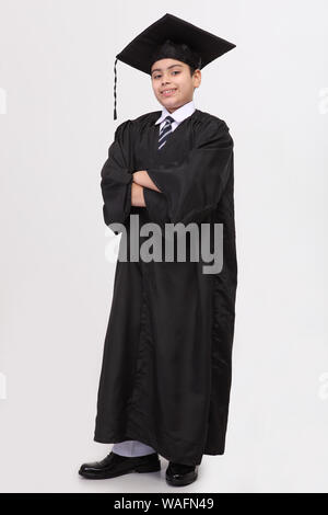 Boy pretending to be a lawyer with his arms crossed Stock Photo
