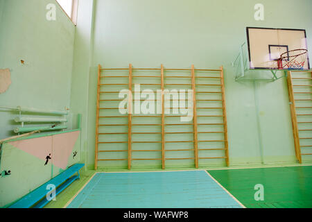 Empty gym in a school with a Swedish wall. Stock Photo