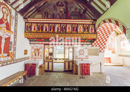 The vibrant interior wall paintings of the c1520 St Teilo's church, Llandeilo at St Fagans National Museum of Welsh History, Cardiff, Wales, UK Stock Photo