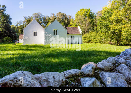 The pastoral setting of the c1520 St Teilo's church, Llandeilo at St Fagans National Museum of Welsh History, Cardiff, Wales, UK Stock Photo