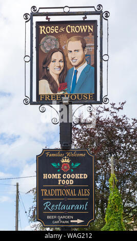Rose & Crown free house pub sign with Will and Kate at Tilshead, near Salisbury, Wiltshire UK in August Stock Photo