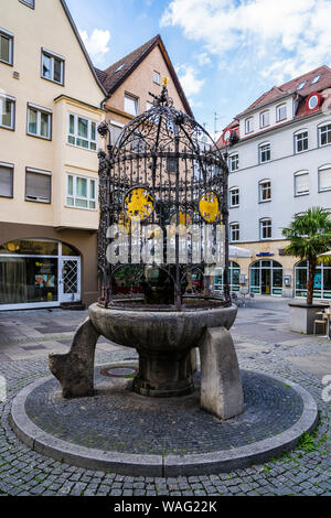 Stuttgart, Germany, August 15, 2019, Famous fountain of lucky hans called hans im glueck brunnen at cobblestone square in downtown restaurant district Stock Photo