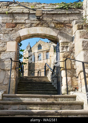 South transept of Ripon Cathedral through an archway on Minster Close Ripon North Yorkshire England Stock Photo