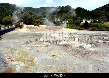 Geysers, Volcano Caldera Hot Springs Fumarole Bubbling Smoking in Furnas, Sao Miguel, Azores, Portugal Stock Photo