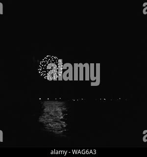 Fireworks at lake celebration by night Stock Photo