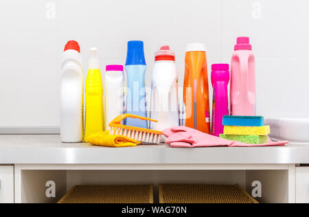 Cleaning items on the table in modern laundry room Stock Photo