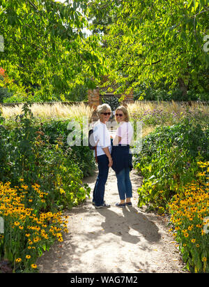 Mother and daughter in garden. Stock Photo