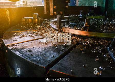 Metal shavings on the details. Metal processing on the machine. Cutting parts on industrial equipment. Metalworking technology. Stock Photo