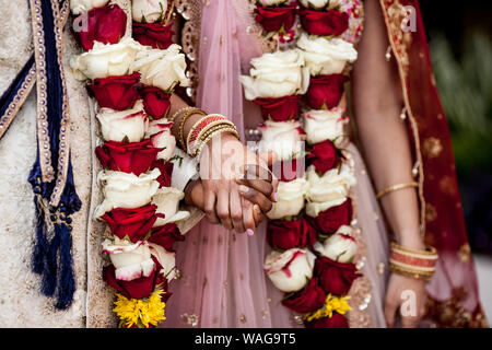 Detail of hands and clothing during Indian wedding ceremony. Stock Photo