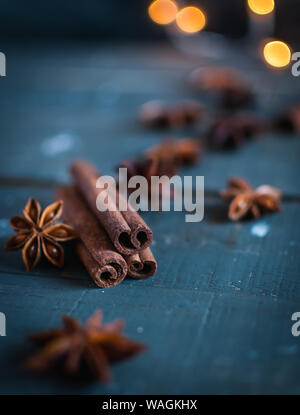 Close-up of cinnamon sticks and star anise on dark background Stock Photo