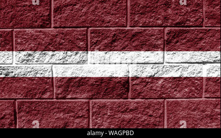 Flag of Latvia close up painted on a cracked wall Stock Photo