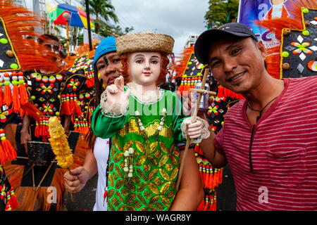 Local People Parade Their Santo Nino Statues Around The Streets Of Kalibo During The Ati-Atihan Festival, Kalibo, Panay Island, The Philippines. Stock Photo