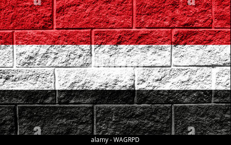 Flag of Yemen close up painted on a cracked wall Stock Photo