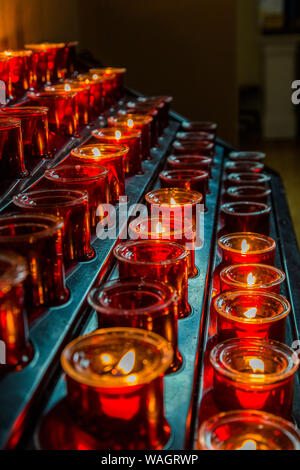 Votive candles or prayer candles in  St Patricks Catholic Church in Newport in County Mayo Ireland Stock Photo