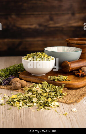 Leek Flakes in a bowl and food preparation and kitchen setting Stock Photo