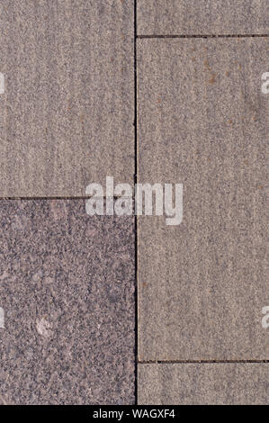 beige weathered granite stone tiled wall background. texture. Stock Photo