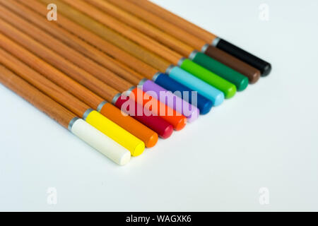 In this photo you can see a set of wooden pencils of different colors. This photo was made in my house in March 2019 Stock Photo