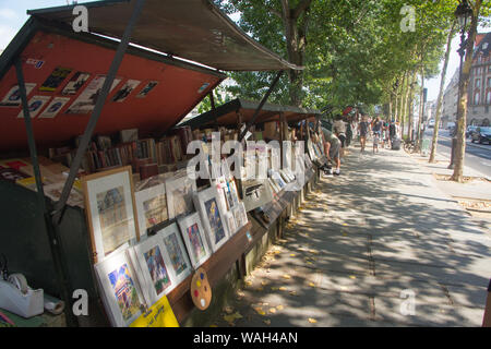 Paris, France - July 07, 2018: Old book market and strolling shoppers on the Seine embankment in Paris Stock Photo