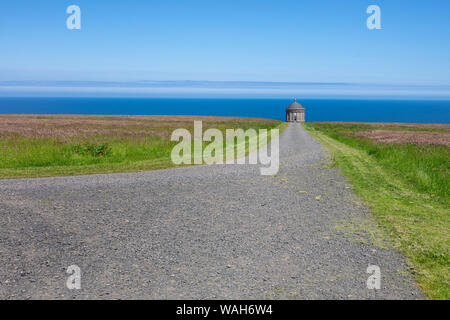 Mussenden Temple against blue sky and Atlantic  ocean on the North-Western coastline of Northern Ireland Stock Photo