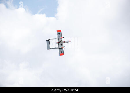 North American Rockwell OV-10 Bronco undercarriage visible during an aerobatic display at airshow Stock Photo