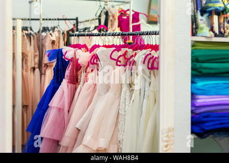 Children clothes on hangers Stock Photo by ©belchonock 117239670