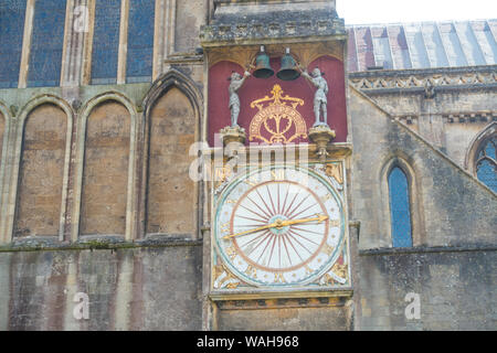 Ancient external clock on the side of Wells Cathedral, Wells, Somerset, England, UK. Stock Photo