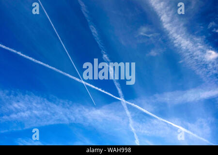 Plane contrails against a blue sky, Basel, Switzerland. Stock Photo